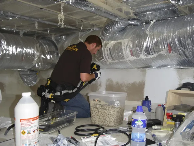 Hopkinton Air Duct Cleaning specialist performing professional mold removal from air ducts in Hopkinton