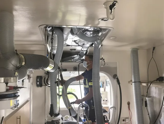 Hopkinton Air Duct Cleaning specialist performing precise mobile home duct cleaning in Hopkinton