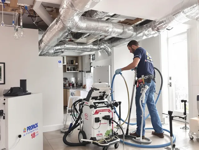 Hopkinton Air Duct Cleaning technician performing advanced pure duct cleaning with specialized equipment in Hopkinton