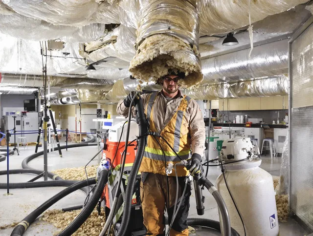 Professional vacuum insulation removal by Hopkinton Air Duct Cleaning expert in Hopkinton